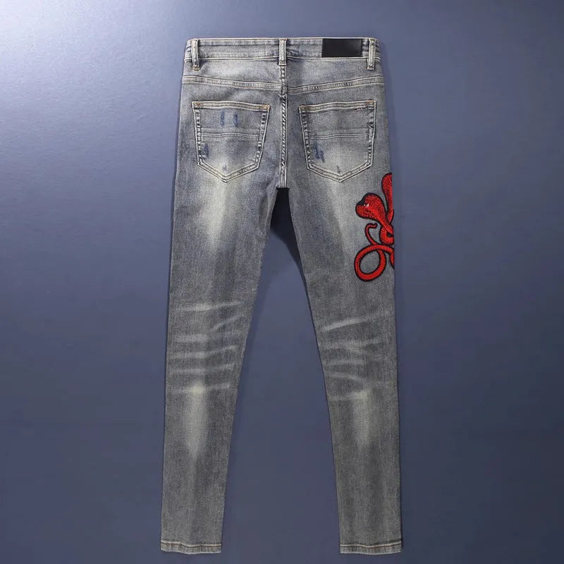Mens old colour distressed patchwork skinny jeans with embroidery on a micro-elasticity cotton fabric.