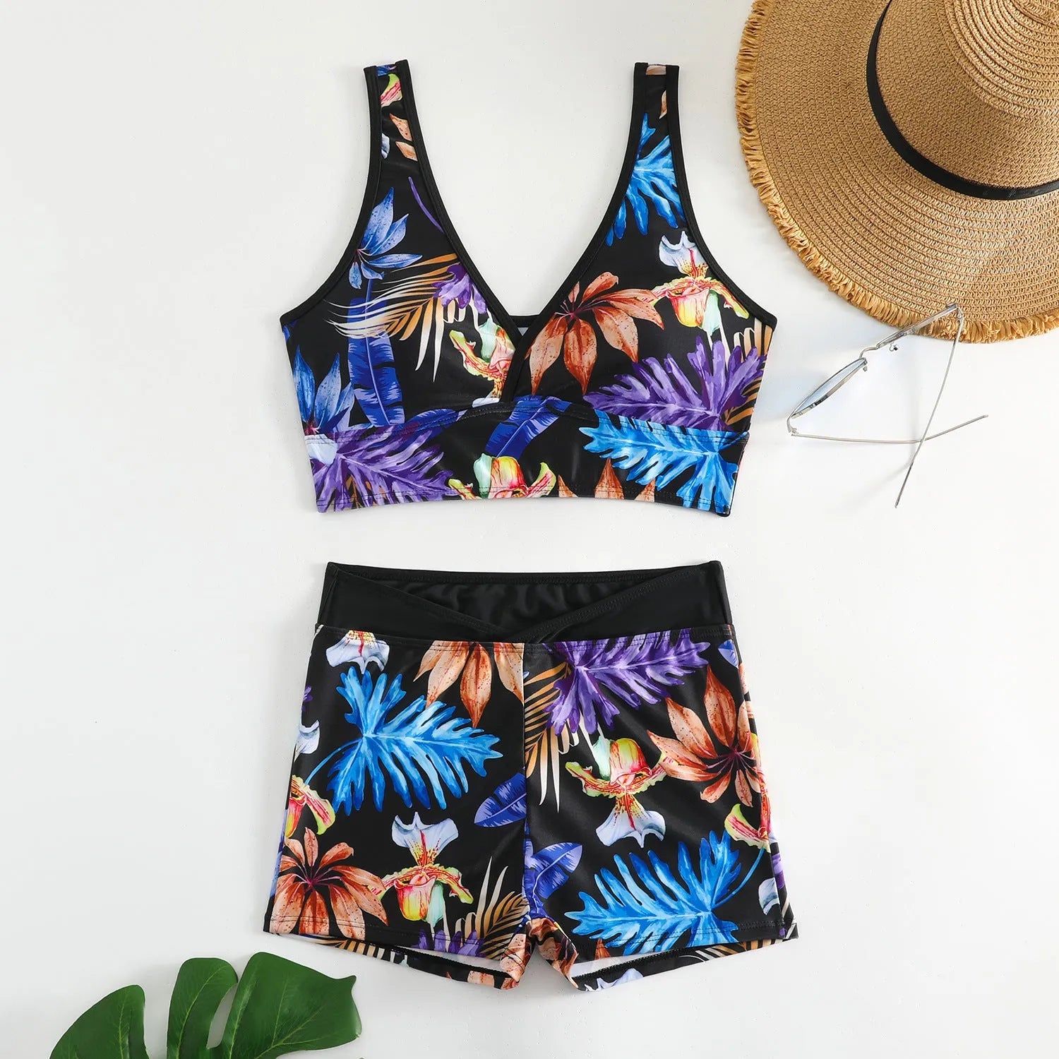 Women's two-piece swimsuit with sleeveless top and printed boxer shorts in multiple colours.
