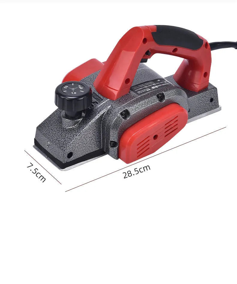Red desktop electric wood planer with aluminium housing showing 82mm cutting width