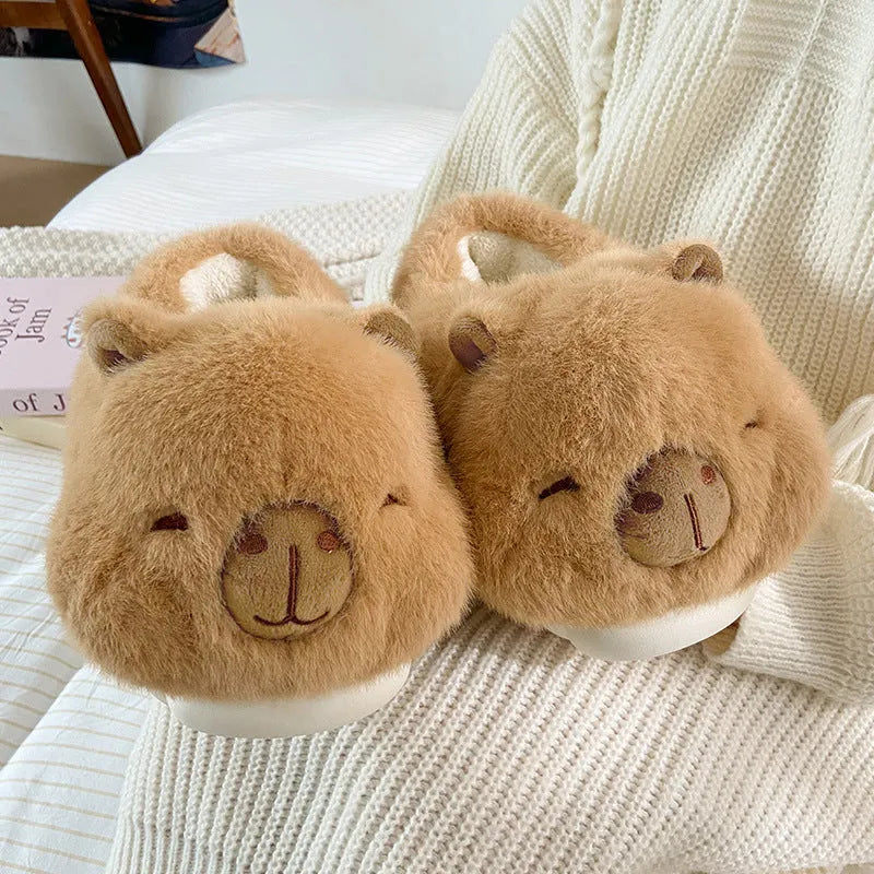 Light brown plush women's winter slippers with artificial wool lining and a round toe.