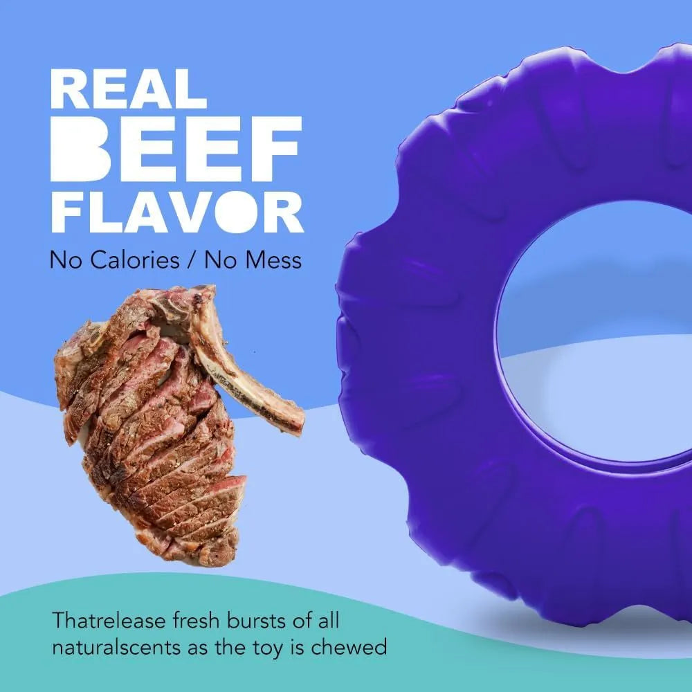 Blue natural rubber dog tyre chew toy with oval openings, shown as a slow feeder and interactive puzzle toy.