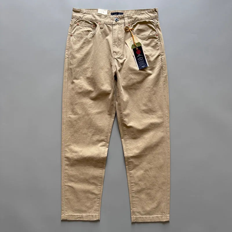Men's grey straight-leg cotton casual trousers laid flat, showing mid-waist and inelastic design.