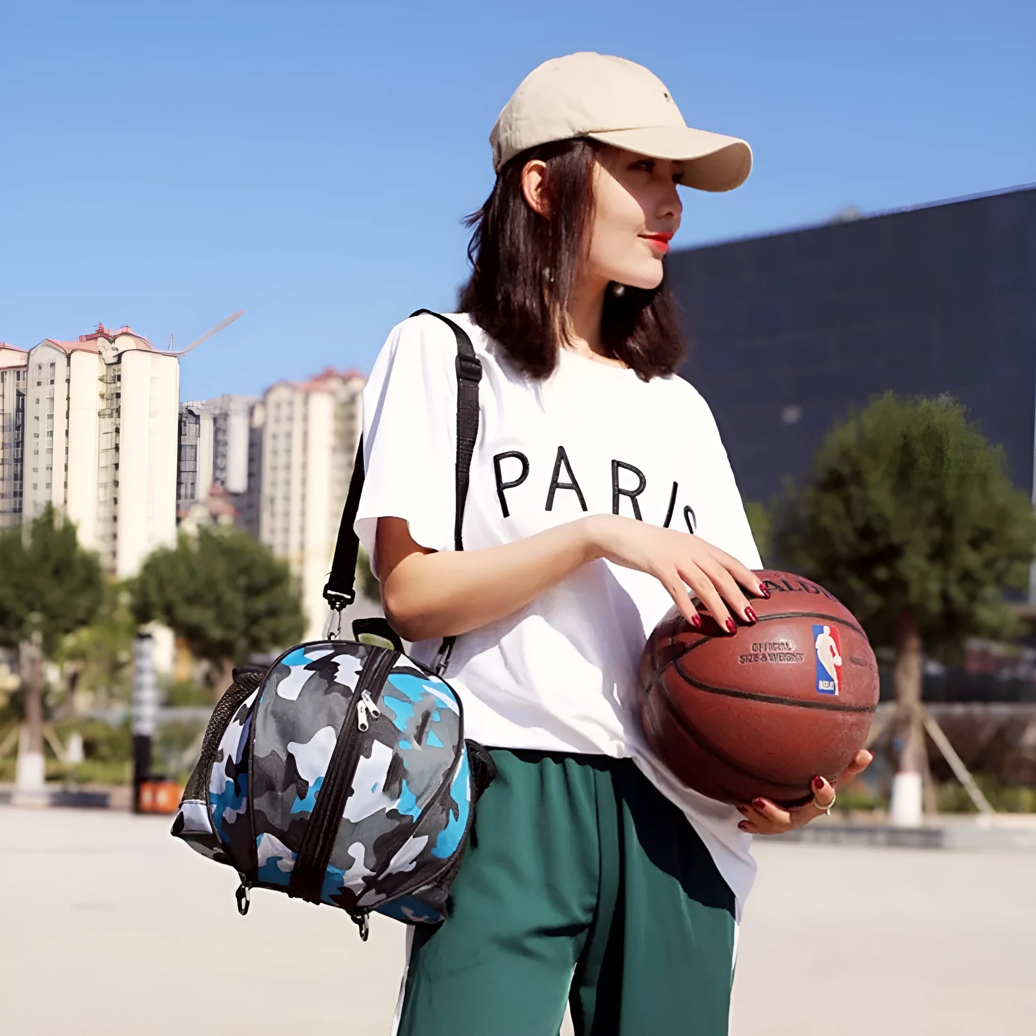 Oxford cloth basketball bag with 9L capacity in black or camouflage featuring one-shoulder and two-shoulder straps
