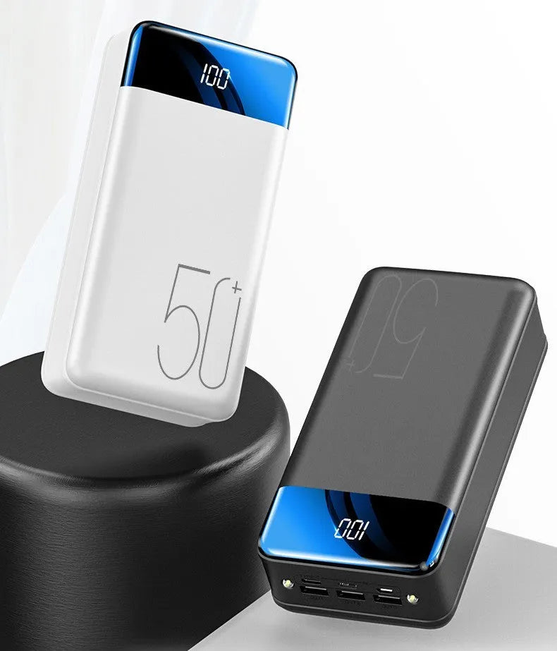 Black and white 50000mAh power bank with three USB output ports showing dimensions 169x83x52mm