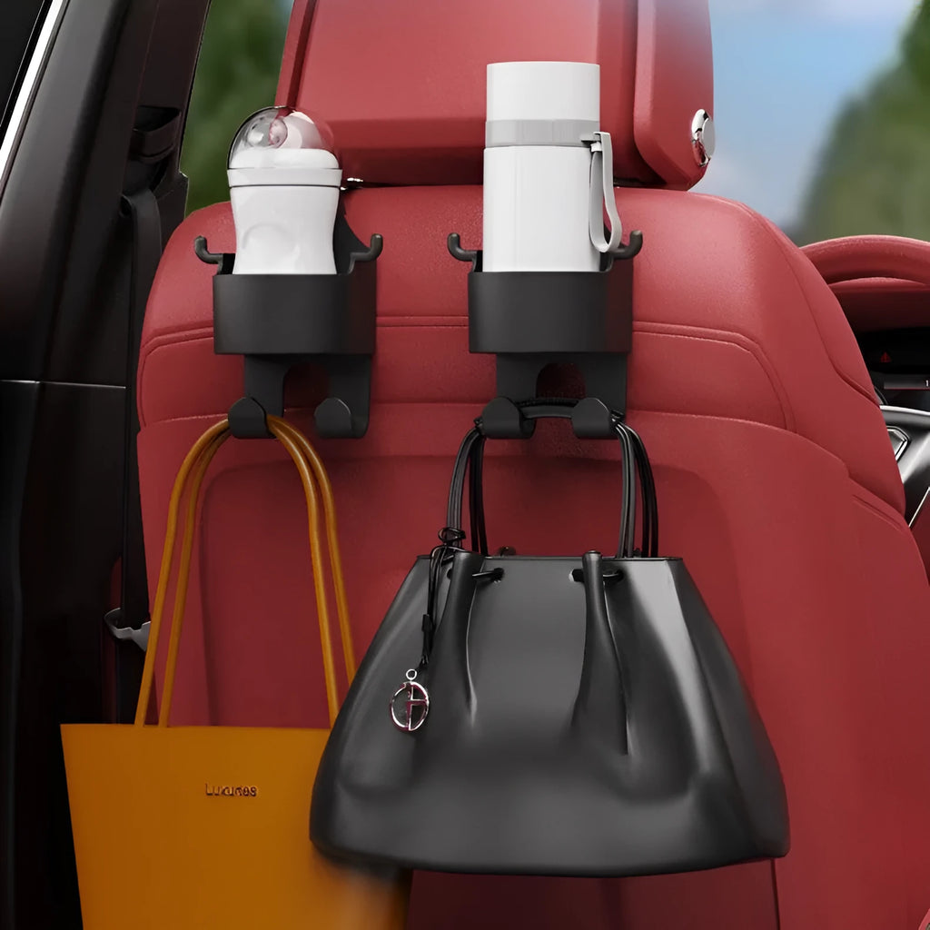 Black plastic car seat back organiser with cup holder and hanging hooks mounted on vehicle headrest