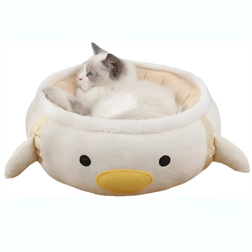Green dinosaur and chick shaped cat bed shown both flat as a sofa and hanging as a hammock for small pets.