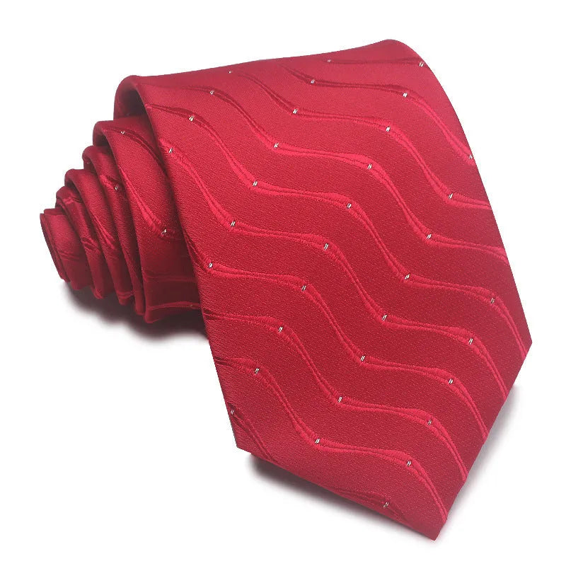 Close-up of a red, black, and blue striped men's formal tie with a textured Jacquard weave.