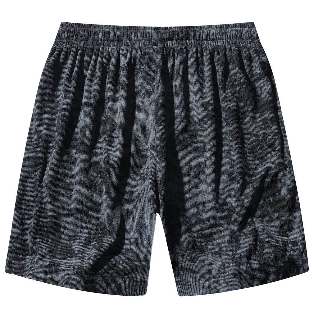 Men's camouflage pattern corduroy shorts with an elasticated high waistband on a plain background.