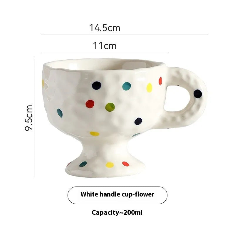 Hand-pinched irregular ceramic mug in solid colour with modern simple style, shown from side angle