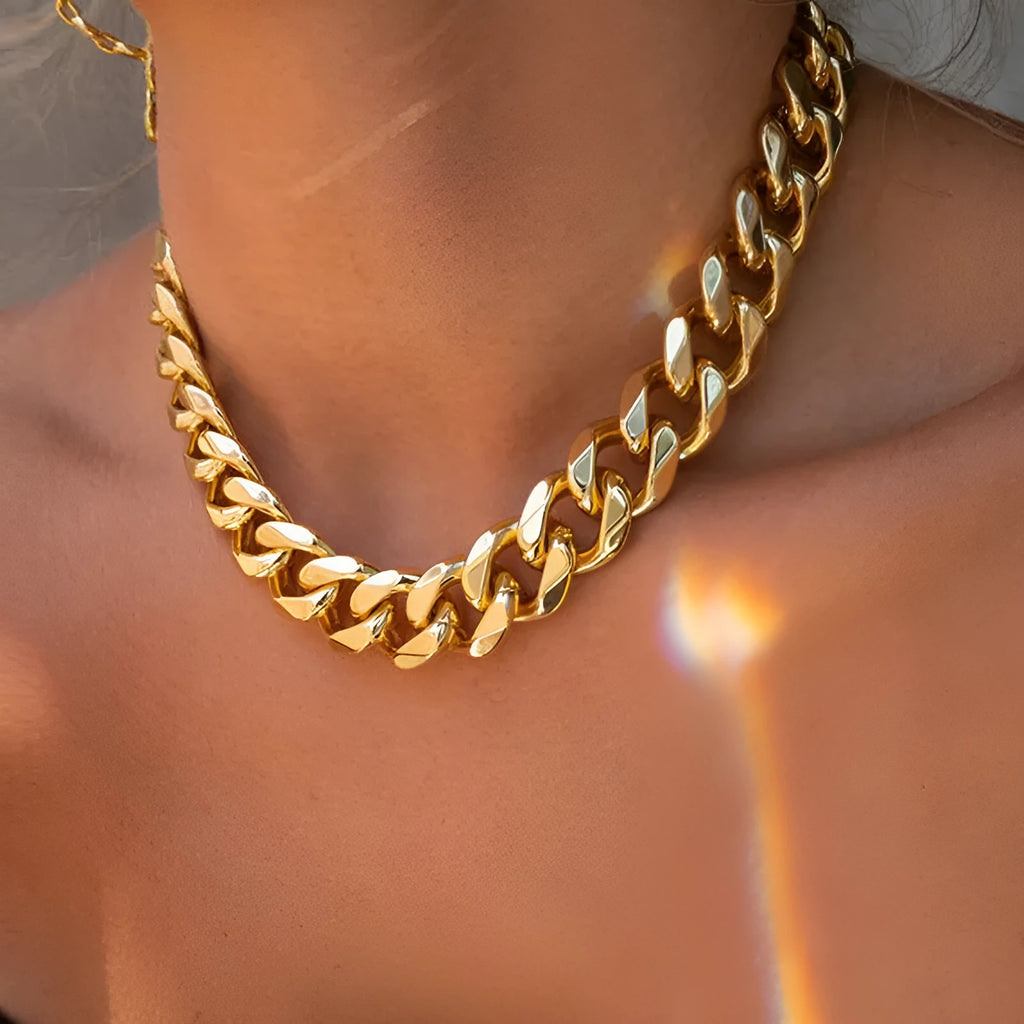 Women's thick chain necklace in dense gold colour measuring 32cm length with simple solid colour design
