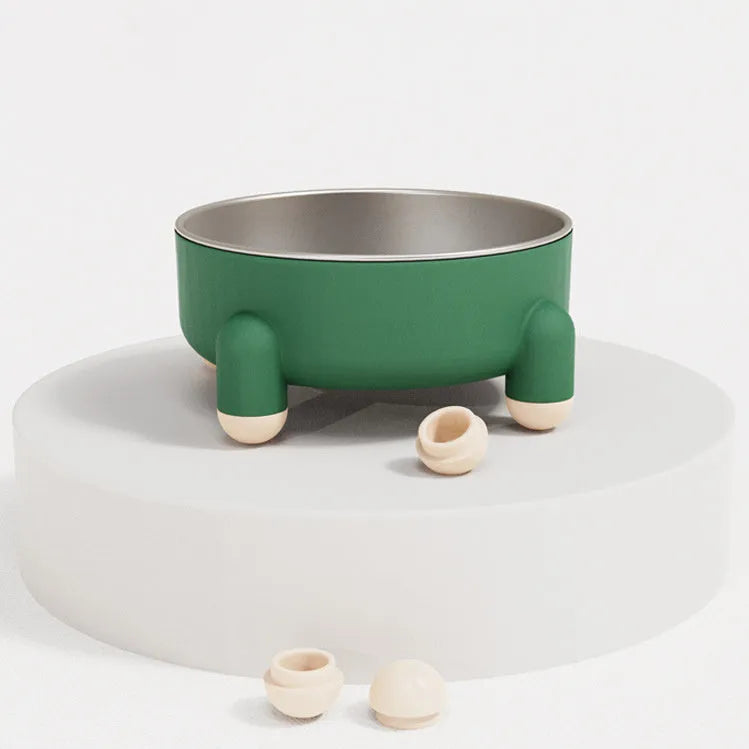 Green stainless steel pet bowl with non-slip base and high foot on a kitchen floor