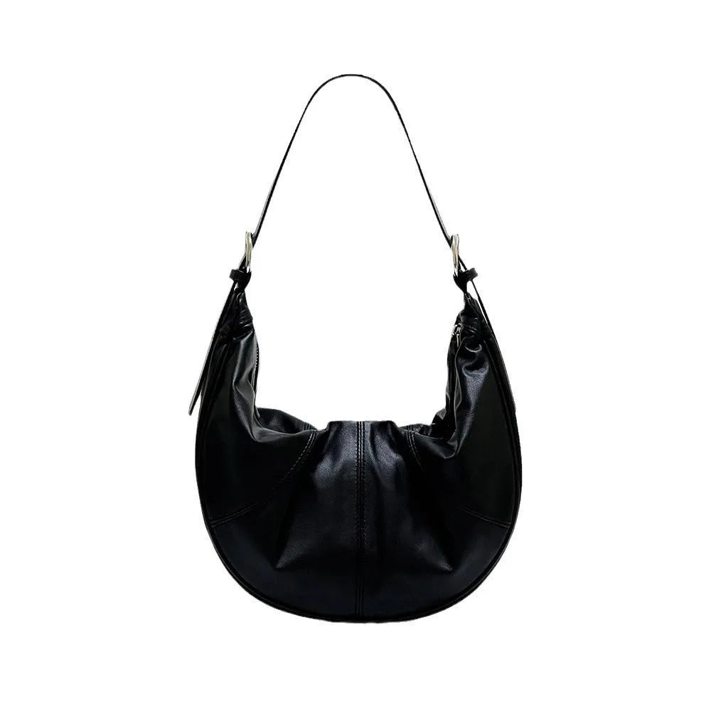 Women's soft cowhide leather dumpling-shaped shoulder bag in black with double straps and sandwich pockets.
