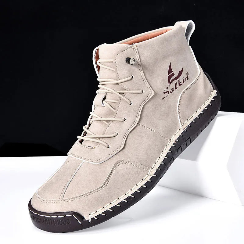 Men's beige retro high-top casual boots with elastic band and round toe on a non-slip rubber sole.