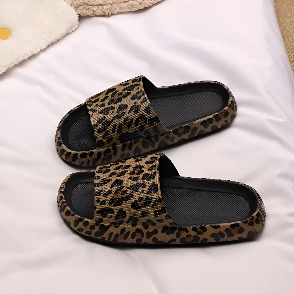 Women's leopard print slipper with thick EVA sole shown in multiple colour and print options.