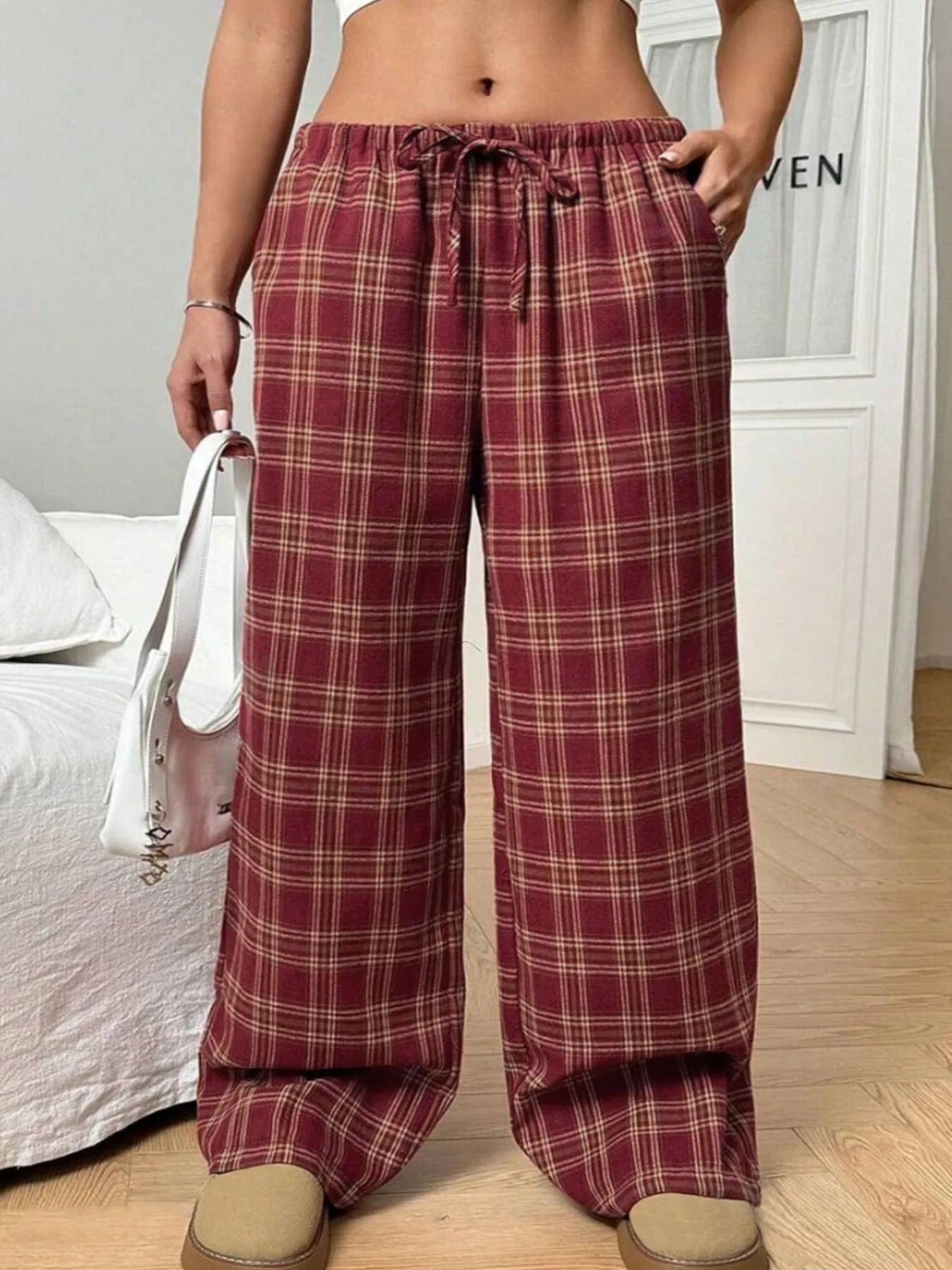 Women's loose fit plaid trousers with drawstring waist and side pockets in red and blue colours