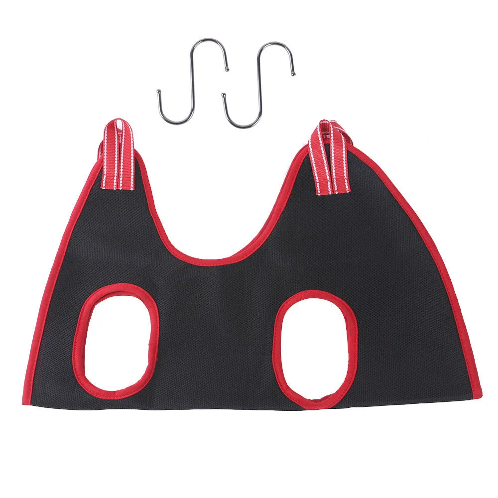 A suspended pet grooming hammock restraint bag in use, showing a small dog being groomed.