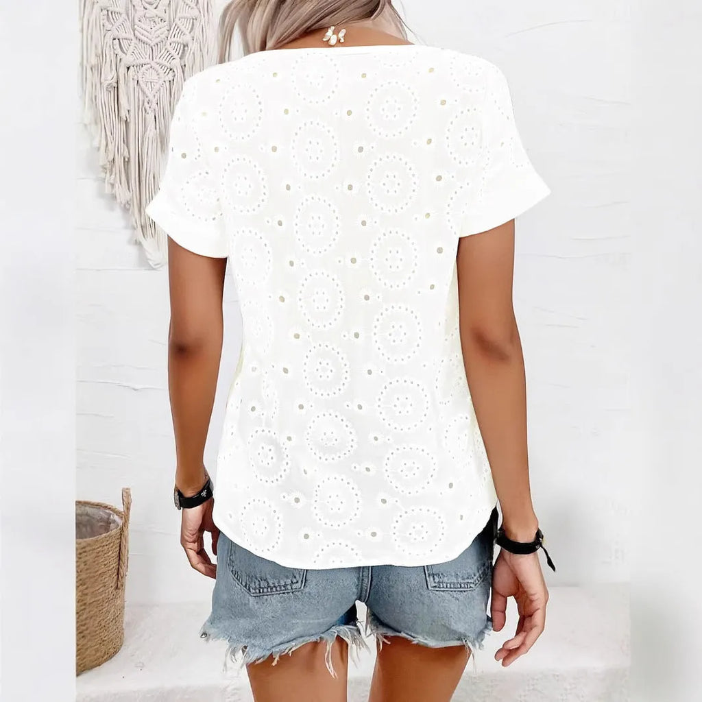White loose V-neck short sleeve T-shirt with a hollow-out design detail.