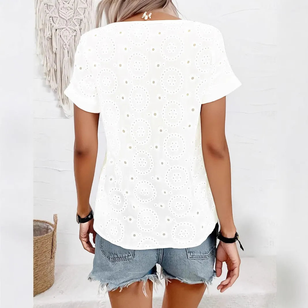 White loose V-neck short sleeve T-shirt with a hollow-out design detail.