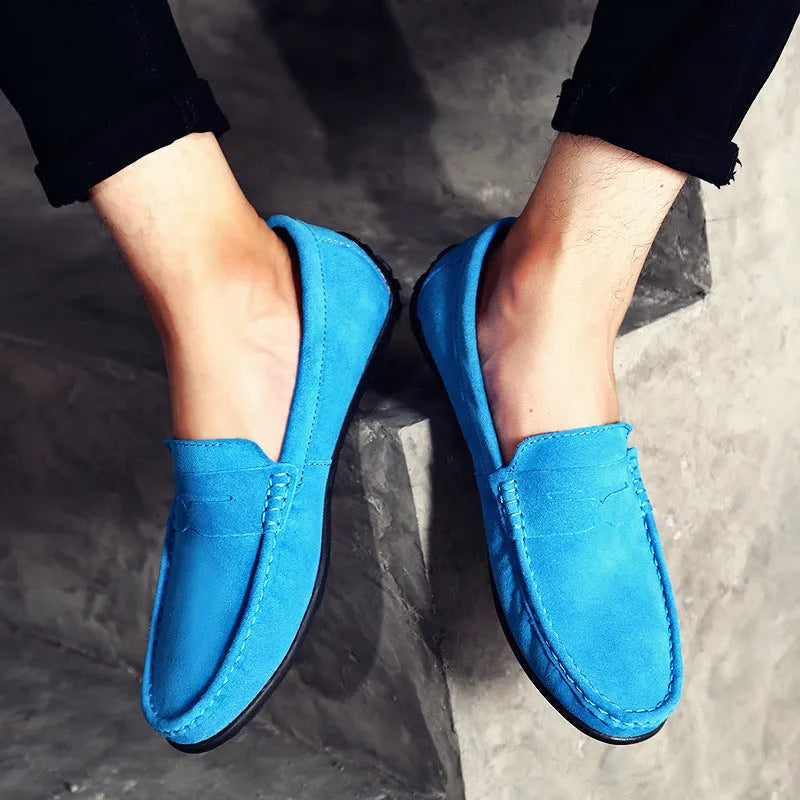 Men's suede leather Gommino casual shoes with flat rubber sole in black colour.