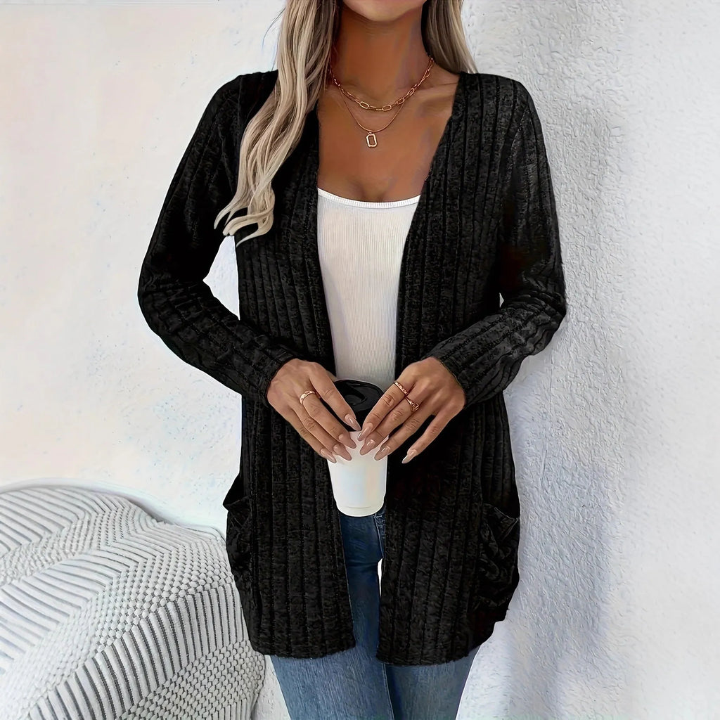 Grandma Grey loose fit long sleeve cardigan with two front pockets, shown on a hanger.