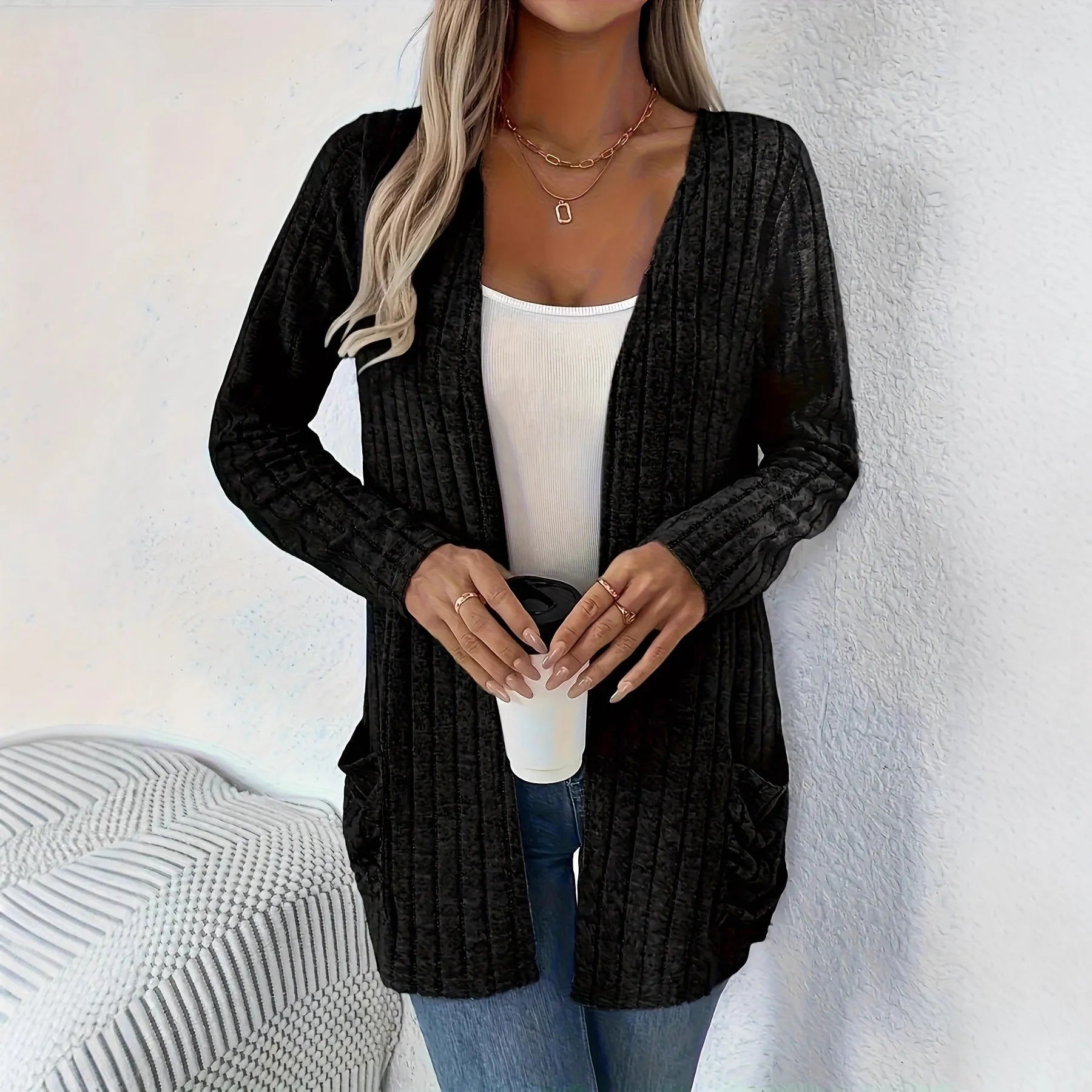 Grandma Grey loose fit long sleeve cardigan with two front pockets, shown on a hanger.