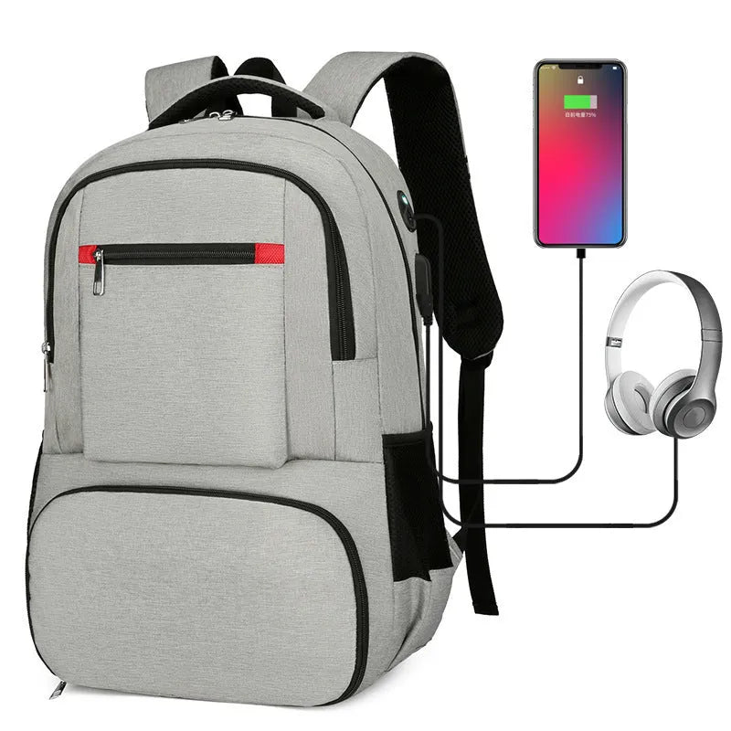 Light grey oxford cloth insulated backpack with curved shoulder straps and top handle.