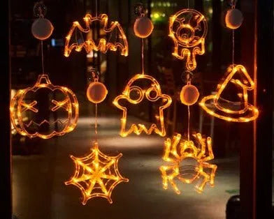 Halloween window hanging LED lights with seven designs including spider, pumpkin, ghost, and bat motifs
