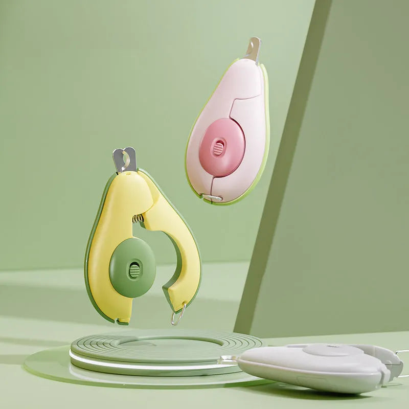 Green pet nail clipper with LED light on, showing scissor design and anti-slip handle for small dogs and cats.