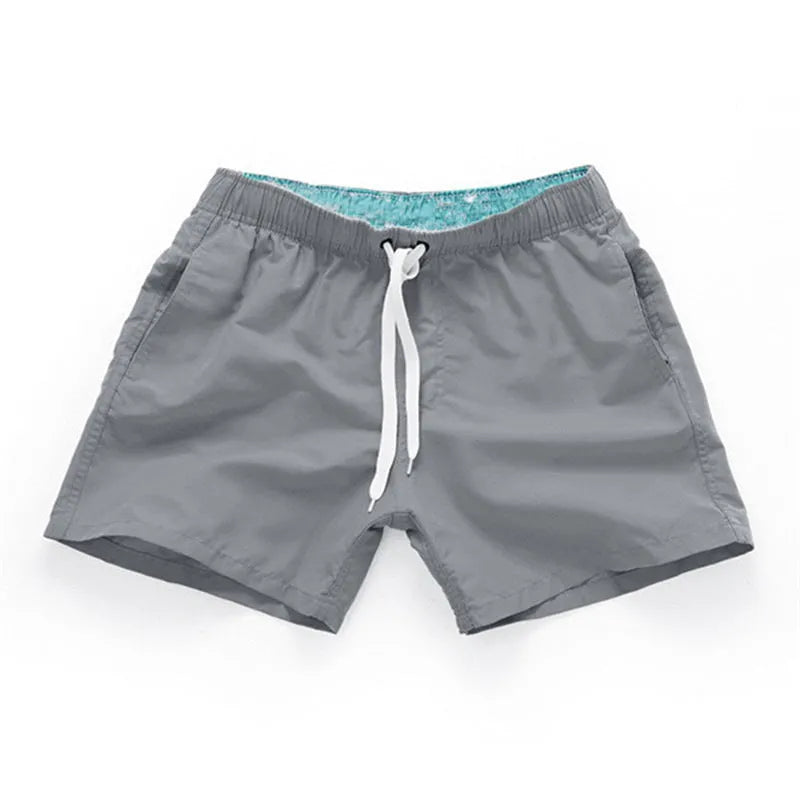 Men's straight leg beach shorts in polyester fabric available in multiple colours and sizes S to 4XL