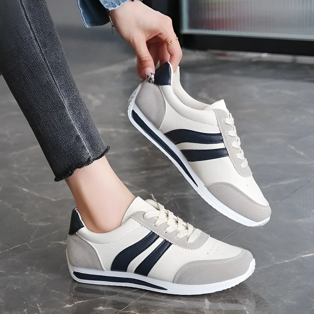 Blue low top lace-up sneaker with soft rubber sole and PU mesh upper