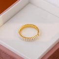 Gold electroplated open mouth ring with geometric design and round elements for women