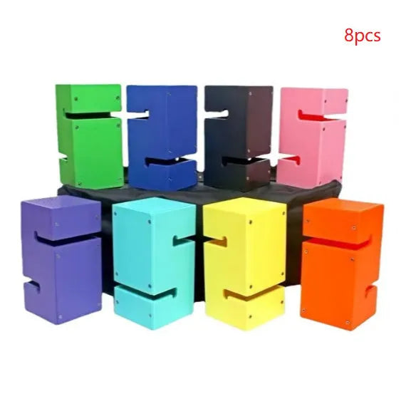 Set of coloured ABS plastic tower blocks with pull ropes and metal hook frame for outdoor team building games.