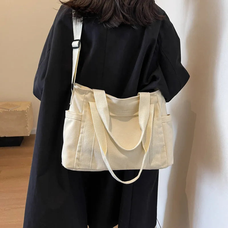 Women's polyester canvas shoulder bag with large capacity and mobile phone pocket in solid colour