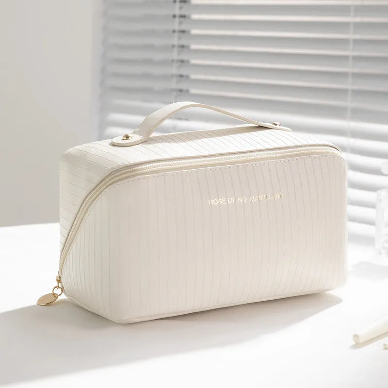 Cubic pillow makeup bag with vertical pattern in five colour options showing 22.5cm dimensions