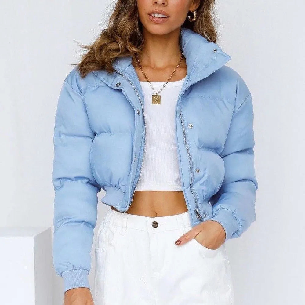 Women's loose blue polyester jacket with regular long sleeves showing front view