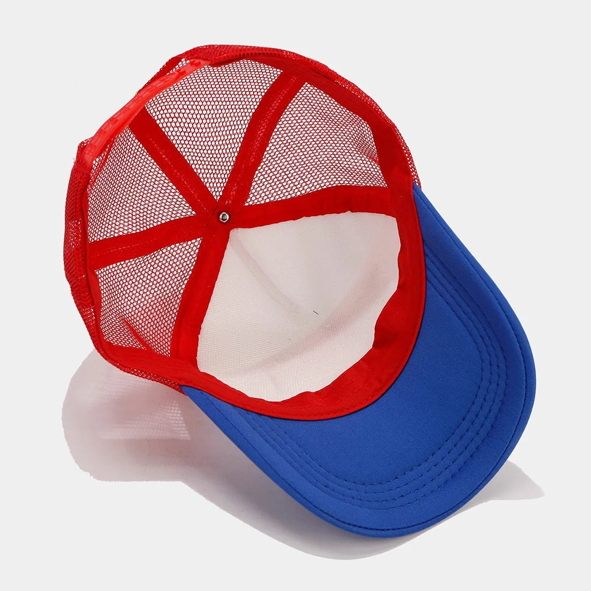 Red and blue contrast mesh baseball cap with an adjustable strap and dome crown.