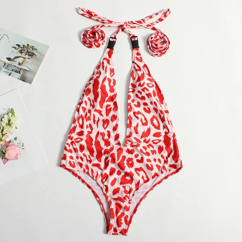 Women's leopard print one-piece swimsuit with buckle bandage detailing and backless design