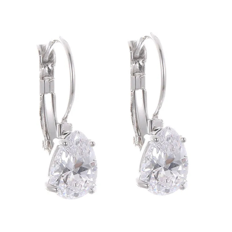 Drop-shaped metal earrings with platinum gem details in gold or platinum colour options