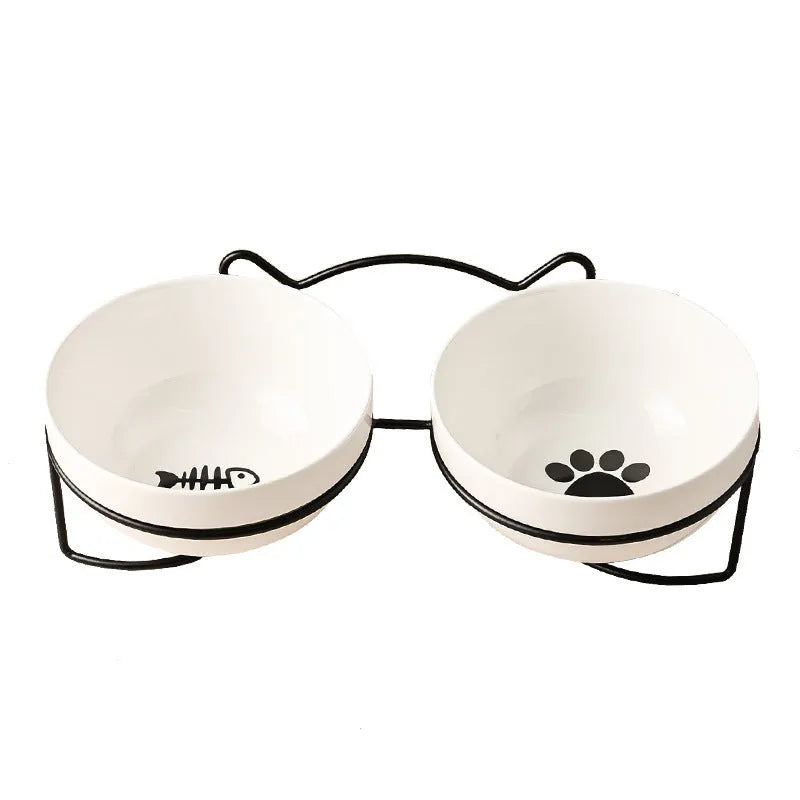 White ceramic pet bowl with cat paw print pattern in black iron frame stand