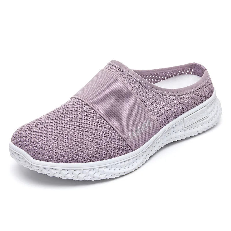 Women's breathable mesh casual shoes with flat heel, round toe, and hollow-out design in black, grey, pink, or purple.