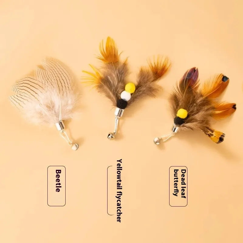 Three small flying insect cat toy replacement heads with steel wire stems on white background
