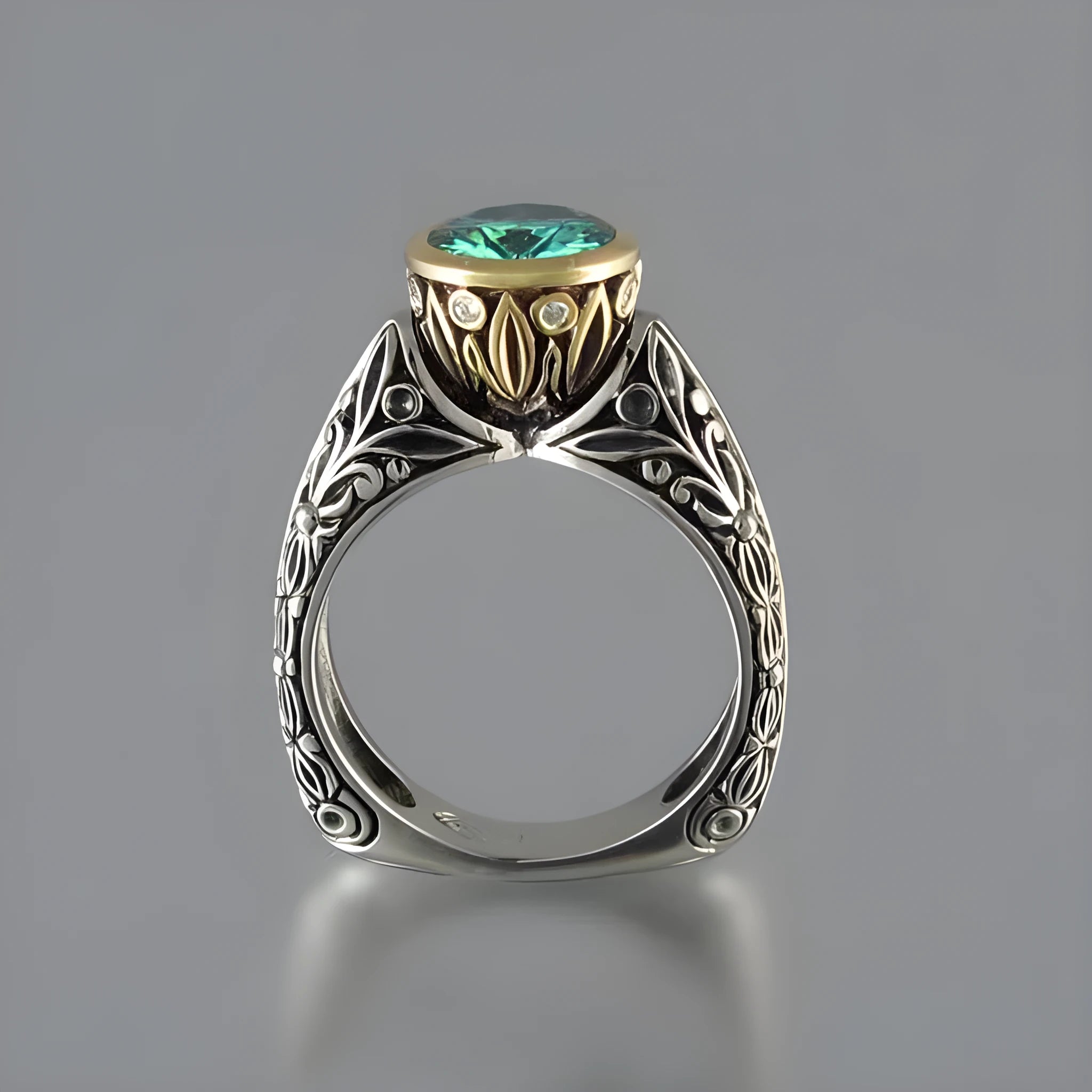Gold-plated women's ring with flower design featuring green gemstone accents and colour separation details