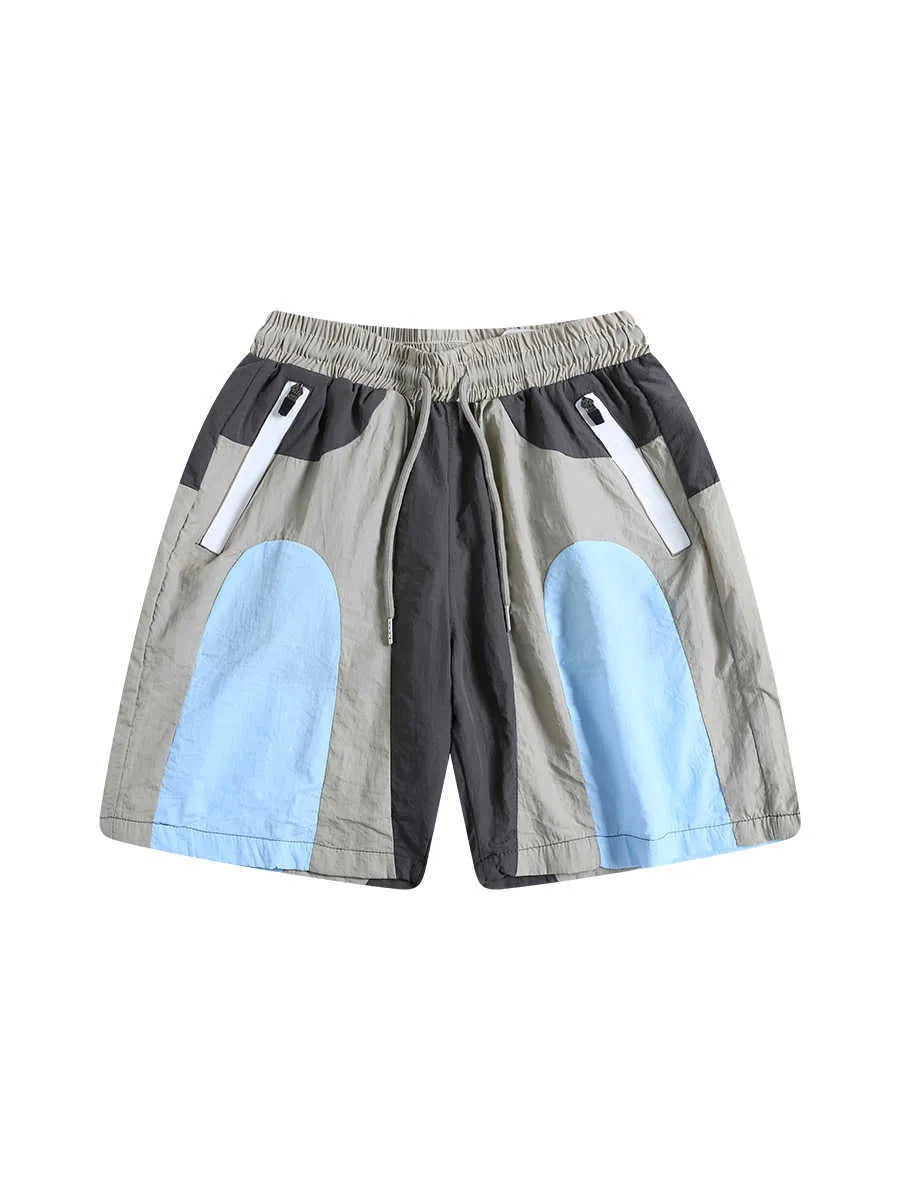 Blue men's patchwork loose-fit quick-drying shorts laid flat, showing straight-leg cut and tether fly.