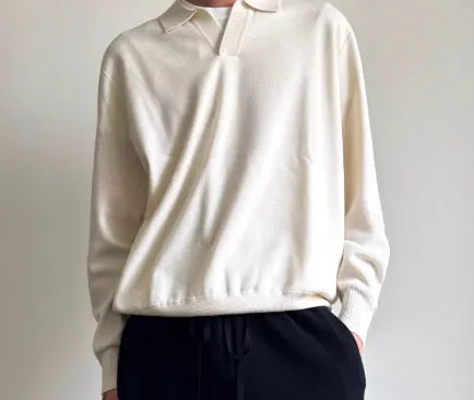 Man wearing a milky white pure wool sweater with a lapel collar and loose fit