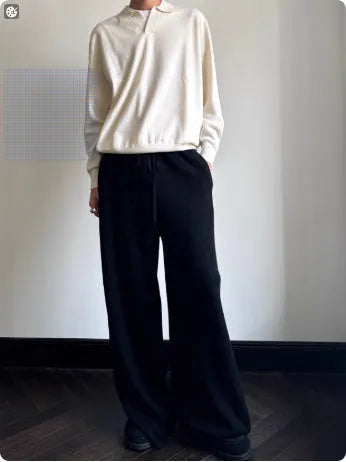 Man wearing a milky white pure wool sweater with a lapel collar and loose fit