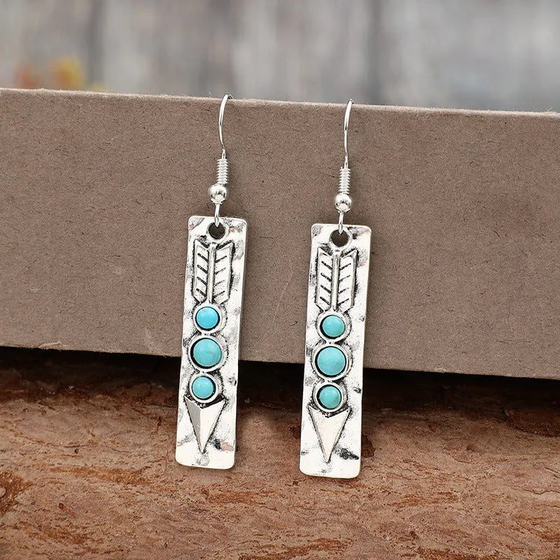 Silver geometric earrings with long strip design and turquoise inlay details