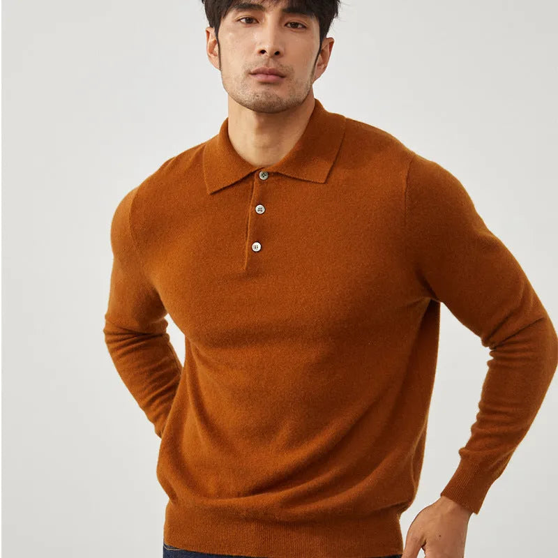 Man wearing a sapphire blue cashmere short sleeve pullover sweater with a polo collar.