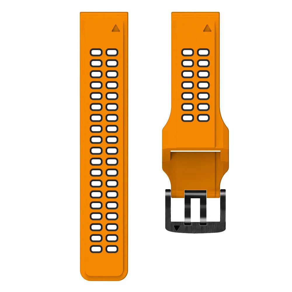 Close-up of a two-tone black and orange silicone watch strap with quick-release pins and a pin buckle.