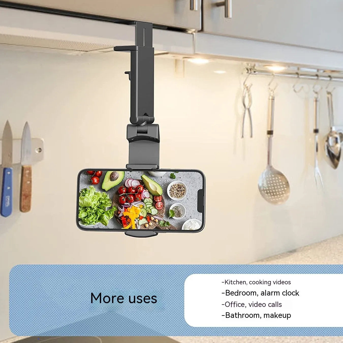 Black foldable rotating phone holder holding a mobile phone upright on a desk.