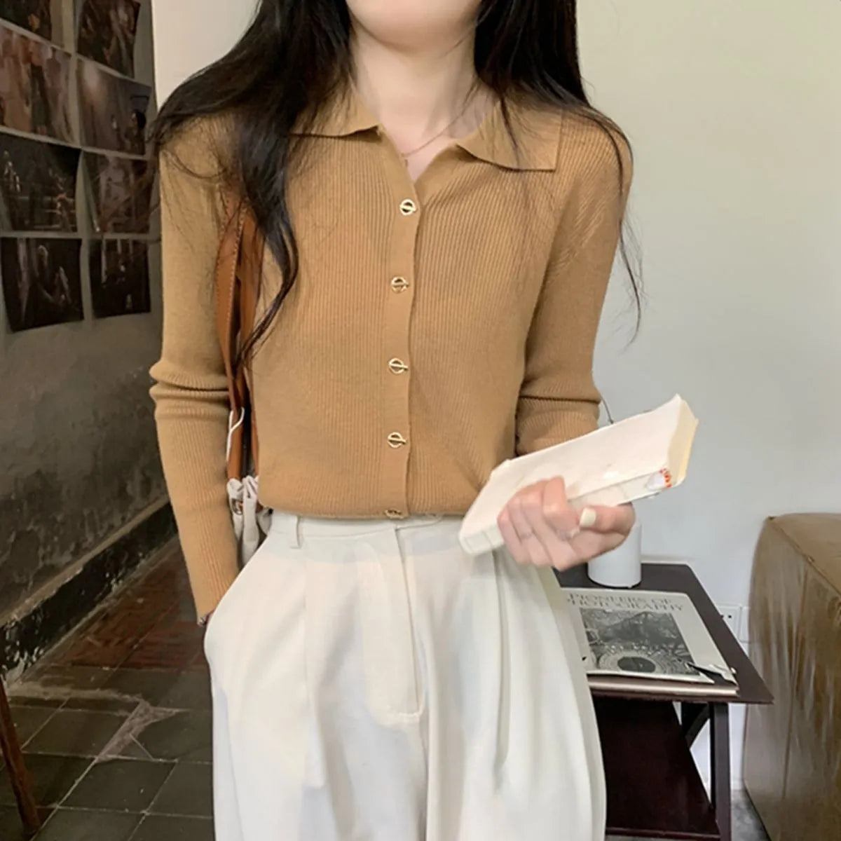 Beige loose fit long-sleeved viscose knitted cardigan top worn open as a layer.